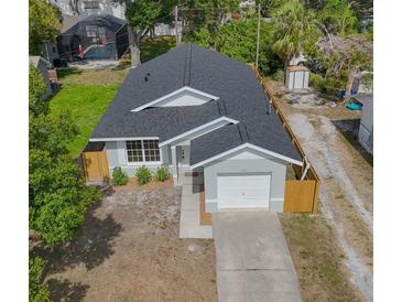 Charming single-story home with a well-maintained lawn, an attached garage, and a fenced yard at 7551 52Nd N St, Pinellas Park, FL 33781