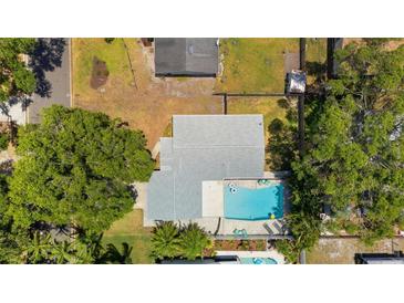 Aerial view showcasing a home with a backyard swimming pool and lush landscaping at 11110 105Th Ave, Largo, FL 33778