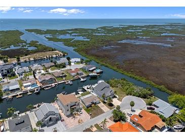 Waterfront homes along canals offer boat access to open water and stunning coastal views at 15713 Century Dr, Hudson, FL 34667