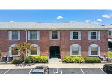 Charming brick condo building with well-maintained landscaping and convenient parking spaces at 3515 41St S Ter # 224, St Petersburg, FL 33711