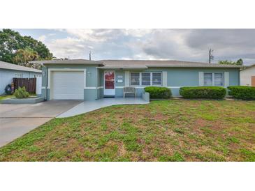 Charming single-story home featuring well-maintained landscaping and inviting curb appeal at 6401 15Th N St, St Petersburg, FL 33702