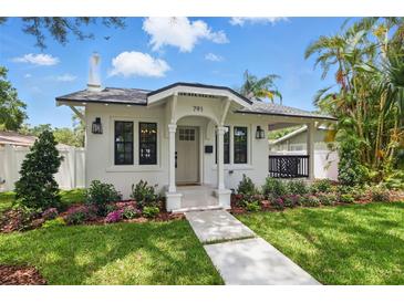 Charming home featuring a well-manicured lawn, fresh landscaping, and a welcoming walkway to the front door at 791 44Th N Ave, St Petersburg, FL 33703