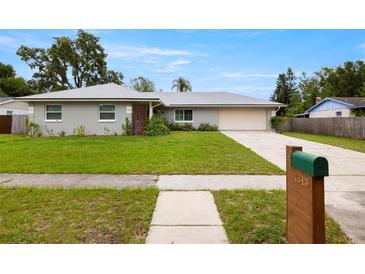 Charming single-story home featuring a well-maintained lawn and inviting curb appeal at 1813 Lakeview Dr, Brandon, FL 33511