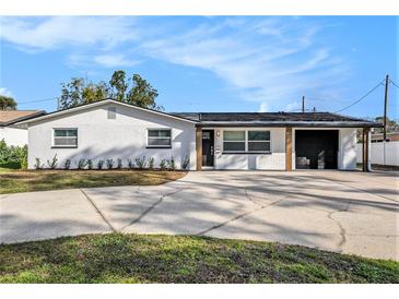 Charming single-story home with a freshly painted exterior and a spacious driveway at 239 Freeport Ne Ave, St Petersburg, FL 33702