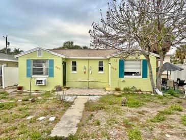 Charming one story home featuring a cozy front yard and well maintained exterior at 503, 509, Cottage, Land 69Th Ave, St Pete Beach, FL 33706