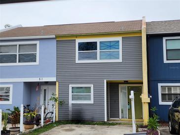 Charming townhomes featuring colorful exteriors, and inviting front entrances at 3041 S Pines Dr # 52, Largo, FL 33771