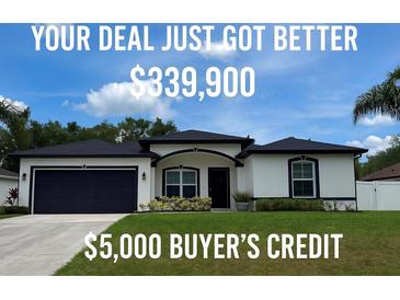 Charming single-Gathering home featuring a well-manicured lawn and a two-car garage at 4264 Michaler St, North Port, FL 34286