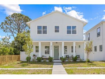 Charming two-story home with light blue exterior, inviting front porch, and well-manicured lawn at 4513 21St N St, St Petersburg, FL 33714