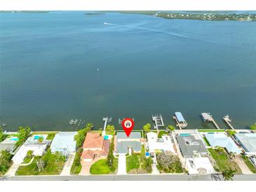Waterfront property featuring a private dock with deep water access to the open bay, offering boating and fishing at 4823 Arlington Rd, Palmetto, FL 34221