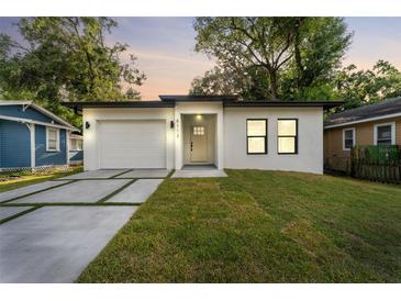 Charming single-story home boasts a freshly painted exterior, a new roof, and a well-maintained yard at 8112 N 10Th St, Tampa, FL 33604