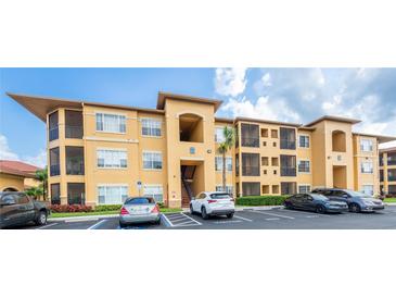 Inviting condo building featuring well-maintained landscaping and dedicated visitor parking spaces at 4345 Bayside Village Dr # 303, Tampa, FL 33615