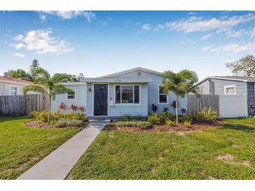 Charming single-story home with a well-manicured lawn and inviting walkway at 4755 21St N Ave, St Petersburg, FL 33713