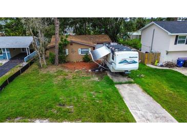 Charming single-Gathering home with a well-maintained lawn and private driveway at 1726 Massachusetts Ne Ave, St Petersburg, FL 33703