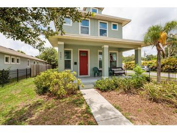 Charming two-story home with a cozy front porch and well-maintained landscaping at 4301 5Th N Ave, St Petersburg, FL 33713