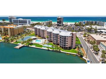 Coastal condo showcases beach access, boat dock, pool, and tennis courts, offering luxury waterfront living at 5445 Gulf Blvd # 210, St Pete Beach, FL 33706