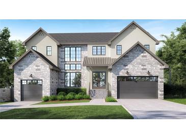 Stunning two-story home featuring a stone facade, modern windows, and a well-manicured lawn at 924 42Nd N Ave, St Petersburg, FL 33703