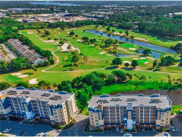 Beautiful aerial view of condos overlooking a meticulously manicured golf course and tranquil waterways at 960 Starkey Rd # 9104, Largo, FL 33771