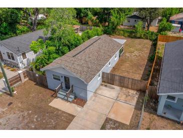 Charming single-story home featuring a well-maintained exterior and a long driveway at 4218 E Cayuga St, Tampa, FL 33610