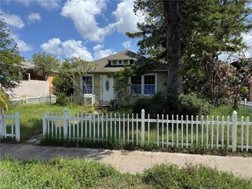 Charming home featuring a quaint picket fence and a well-maintained lawn at 341 20Th S Ave, St Petersburg, FL 33705