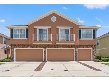 Inviting townhome with a three car garage, stone accents, balconies, and beautifully painted exterior at 589 52Nd N Ave, St Petersburg, FL 33703