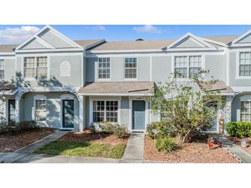 Charming townhome featuring a quaint entrance and well-maintained landscaping at 2248 Lake Woodberry Cir, Brandon, FL 33510