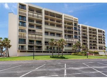 Beautiful condo building with palm trees and well-maintained landscaping in a desirable location at 1430 Gulf Blvd # 707, Clearwater Beach, FL 33767
