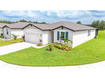 Beautiful single-story home with well-manicured lawn and landscaping for great curb appeal at 3082 Forrest Plum Ct, Zephyrhills, FL 33540