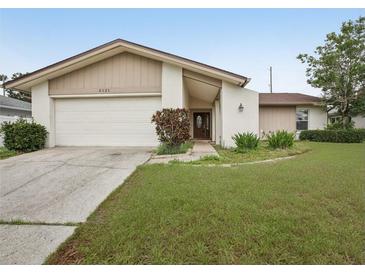 Charming single-story home with well-maintained lawn, garage, and neutral color scheme at 3121 Egret Ter, Safety Harbor, FL 34695