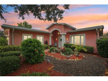 Charming single-story home boasting a beautifully landscaped front yard and inviting entrance at 6897 18Th N St, St Petersburg, FL 33702