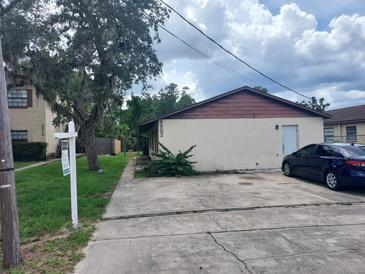 Charming single-story home with a well-maintained lawn and classic design at 9902 N Myrtle St, Tampa, FL 33617