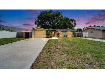 Charming home with a well-maintained front yard and long driveway at 3619 15Th Se Ave, Largo, FL 33771