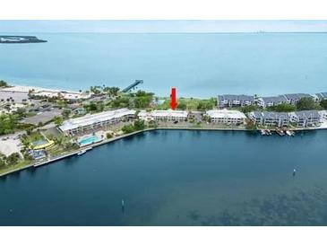 Panoramic aerial view of waterfront condo community featuring lush landscaping and marina access at 611 Destiny Dr, Ruskin, FL 33570