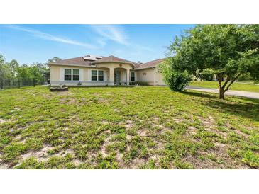 Charming single-story home featuring a well-maintained lawn and inviting curb appeal at 15348 Glossy Ibis Rd, Weeki Wachee, FL 34614