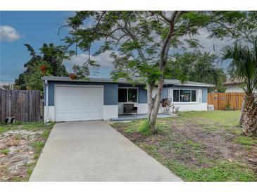 Charming single-story home featuring a well-maintained front yard and attached garage at 10703 59Th Ave, Seminole, FL 33772