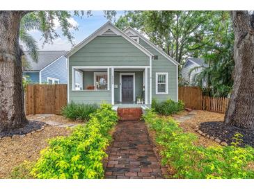 Charming craftsman home features a brick path, manicured landscaping and welcoming front porch at 2439 6Th N Ave, St Petersburg, FL 33713