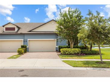 Charming single-Gathering home has well-maintained landscaping, a brick driveway and two-car garage at 16898 Balance Cv, Land O Lakes, FL 34638