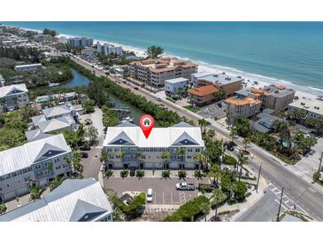 Coastal townhomes with beach access and a private parking area offer stunning views of the ocean at 204 Haven Beach Ct, Indian Rocks Beach, FL 33785