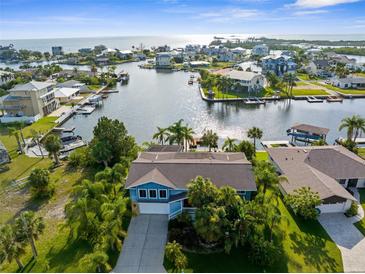 Stunning waterfront home with lush landscaping and scenic views of the surrounding waterways and neighborhood at 4523 Gulfstream Dr, Hernando Beach, FL 34607