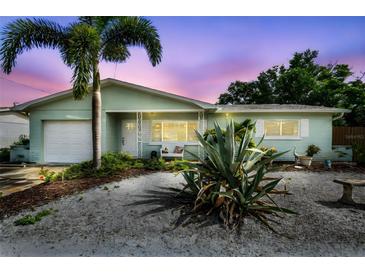 Charming single-story home with lush landscaping and a well-maintained exterior and manicured lawn at 11775 84Th Ave, Seminole, FL 33772