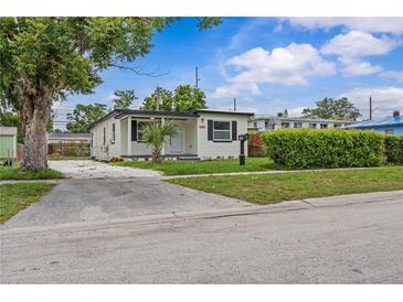 Charming single-story home with a stucco exterior, dark trim, and a well-maintained front yard at 2465 16Th S Ave, St Petersburg, FL 33712