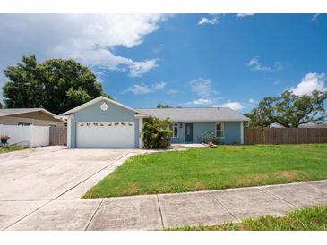 Charming single-story home with a well-manicured lawn and an attached two-car garage at 3905 31St W Ave, Bradenton, FL 34205