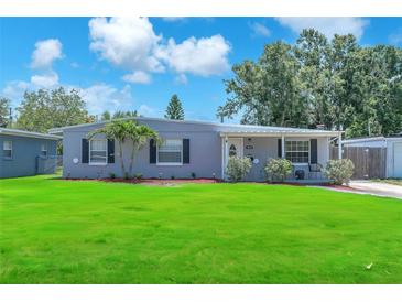 Charming single story home featuring a well-manicured lawn and welcoming front entrance at 5927 10Th N St, St Petersburg, FL 33703