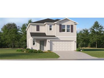 Charming two-story home featuring a gray color scheme, green door, and an attached two-car garage at 11729 Brae Way, Dade City, FL 33525
