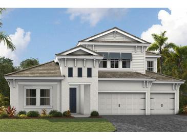 Elegant two-story home boasting a three-car garage and manicured lawn, offering a blend of comfort and sophistication at 10305 Longmeadow Ave, Parrish, FL 34219