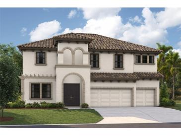 Stunning two-story home featuring a tile roof, stucco exterior, arched entryway, and three-car garage at 13746 Heartwood Way, Parrish, FL 34219