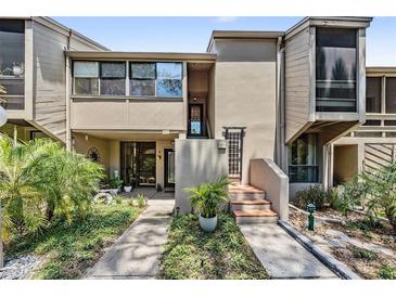 Charming townhouse featuring a well-maintained front yard, and a unique architectural design at 1111 N Bayshore Blvd # E10, Clearwater, FL 33759