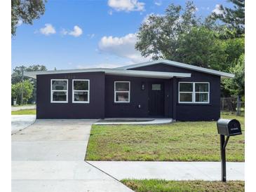 Charming single-story home with a well-maintained lawn and freshly painted exterior at 2010 4Th W Ave, Palmetto, FL 34221