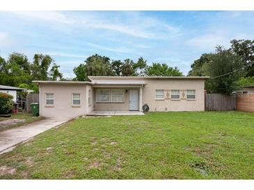 Charming single story home with a well-maintained lawn and welcoming entrance, perfect for easy living at 4323 S Lois Ave, Tampa, FL 33611