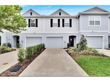 Charming townhouse with well-maintained landscaping and a one-car garage at 4743 Deer Track St, Tampa, FL 33610