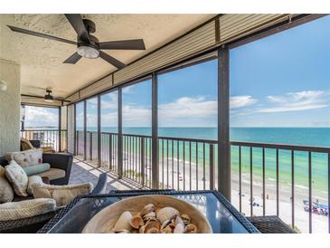 Spacious balcony with ceiling fan and stunning views of the beach and ocean at 15000 Gulf Blvd # 901, Madeira Beach, FL 33708